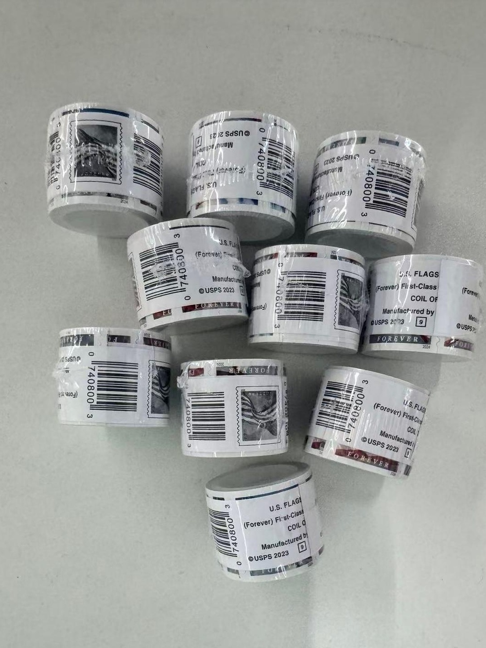 10 rolls of U.S. Postal Service stamps, totaling 1,000 brand new stamps.